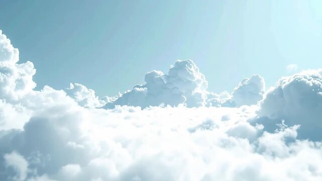Serene aerial view of f white clouds against a clear blue sky, creating a peaceful atmosphere.