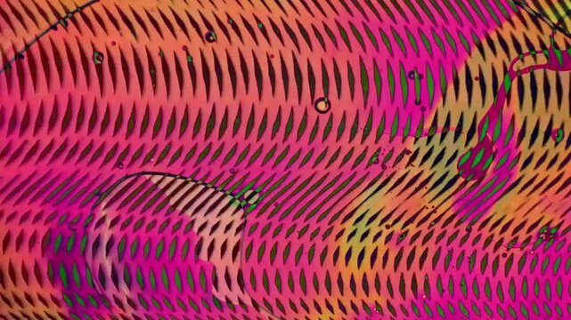 1970s psychedelic liquid projection with vibrant colours. Artistic dye pattern in ink and oil. Abstract artwork of cosmic visual reaction.