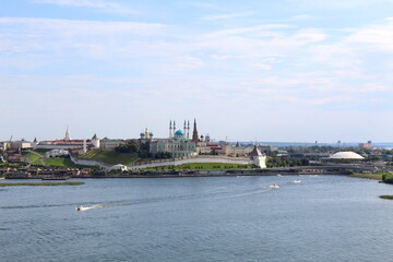 Fototapeta premium The city is visible from afar on the river bank. 