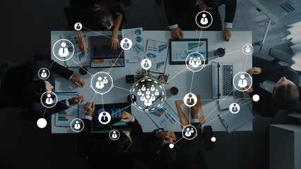 Business professionals collaborating in a modern workspace with digital connections showcasing...