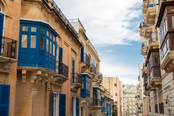 Fototapeta premium Building facades on historic streets in Malta Sliema with balconies