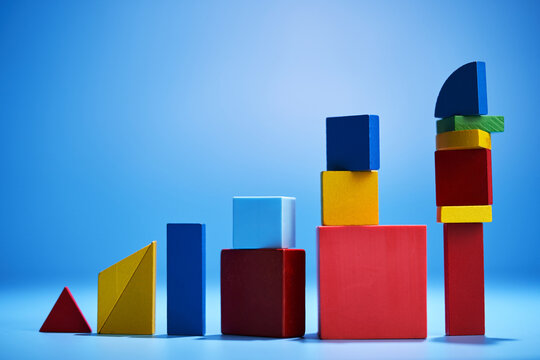 Abstract ascending coloured bar on blue background still life.
