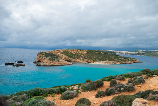 Rocks on the island of Malta's Blue Lagoon with turquoise sea water