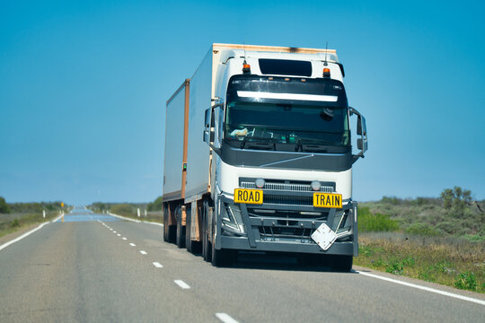 Scenic view of a fast-moving road train traveling through Western Australian landscape
