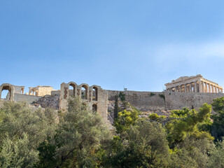 Obraz premium Athens Greece. Parthenon and Herodeion on Acropolis hill, blue sky, sunny day.