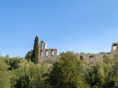 Athens, Greece. Odeon of Herodes, Herodeion on Acropolis hill, blue sky, sunny day.