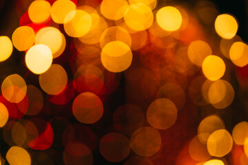 Abstract defocused light background with yellow and orange bokeh circles, conveying warmth,...