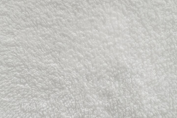 Soft white faux fur fabric texture close-up