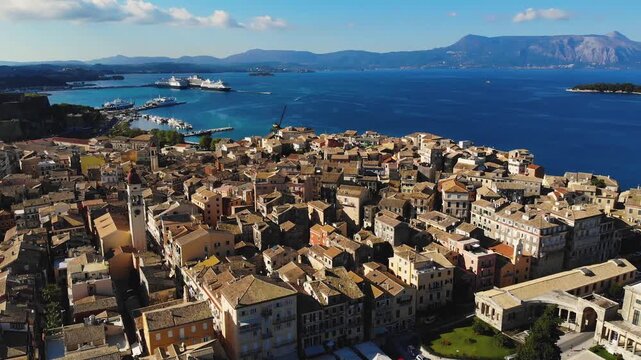 Kerkyra city, Corfu island, Greece, beautiful summer aerial drone view of Kerkyra old town center, with Ionian sea harbour port, Saint Spyridon Church, the Royal Palace and The Old Fortress 