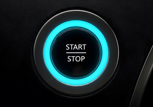 Modern automotive push engine ignition button glowing blue, close up macro detail of the vehicle start stop system, luxury transportation technology