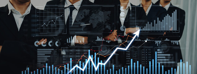 A diverse group of business professionals stands confidently in a modern office, analyzing data through various graphs and charts representing growth and success strategies. Scalp