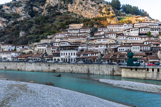 Traditional residential district with historic houses and Osum river in the foreground in the old town area of Berat, Albania
