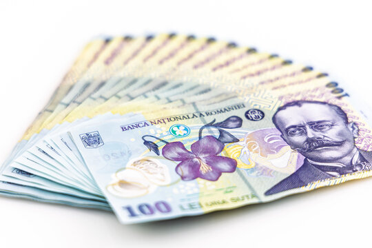 Romanian currency. Banknotes of 100 lei, currency code, RON, on a white background.