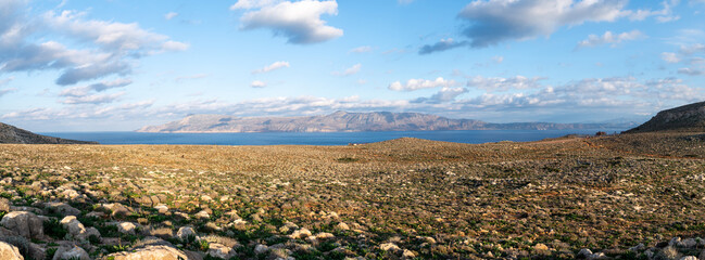 Rocky Coastal Landscape in Crete With Mountains and Blue Sky Panorama