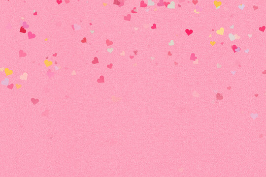Shimmering pink glitter background adorned with a vibrant cascade of multi-colored heart confetti
