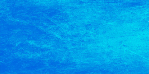 An abstract blue grunge background features a cool turquoise water surface pattern with clear ripples and light reflections on a wet liquid ocean texture