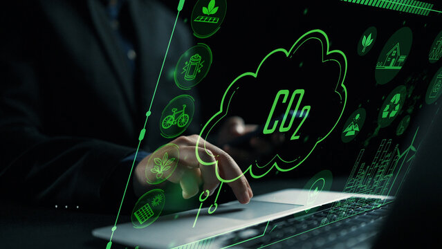 Business professional analyzing green energy solutions to reduce carbon dioxide emissions through advanced technology and sustainable practices in a digital environment. Cipher