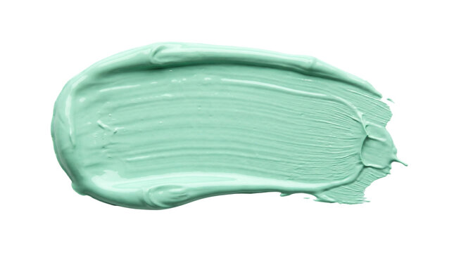 Mint green acrylic paint smear with creamy blended texture and curved brush movement isolated on transparent background
