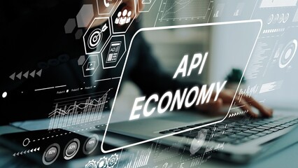 Businessperson Engaging with Digital Technology on Laptop Reflecting API Economy in Modern Work Environment. Asymptotic smart data analytic.
