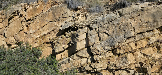 Layered rock with cracks and natural texture