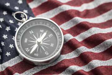 Compass on wavy American flag