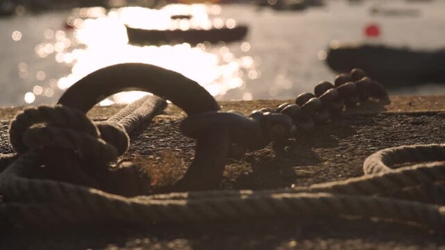 Old rusty chains at sunset