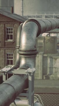 Pipelines and valves form textured industrial facade feature, Exposed pipes and joints contribute to gritty factory aesthetic and functional pathway