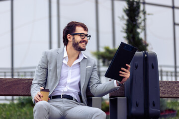 Young Businessman Reviewing Paper Report on Bench