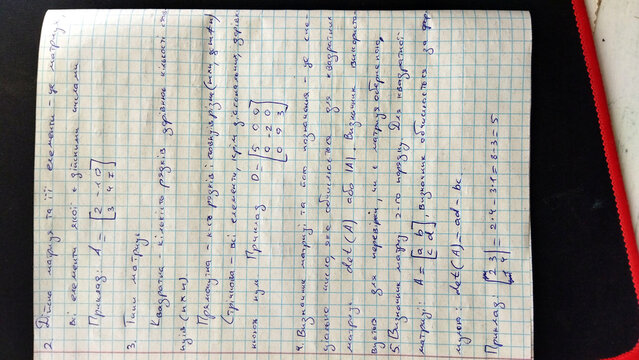 Notes written in a notebook during a study session in a classroom