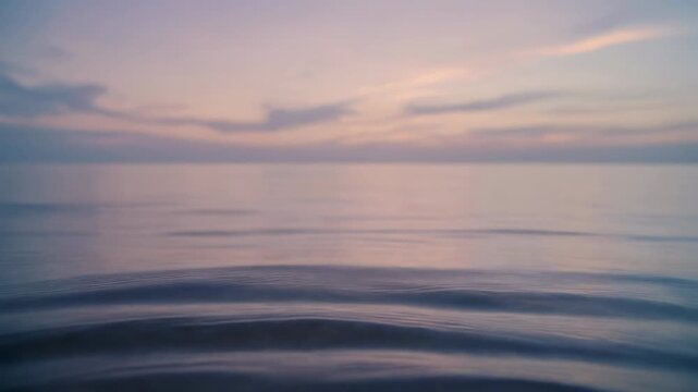 Serene ocean surface with gentle ripples under a pastel sunset sky. Peaceful and meditative nature triptych background for relaxation, wellness and mindfulness concepts