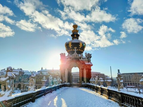 Snow-covered historic city of Dresden with famous landmarks during winter.