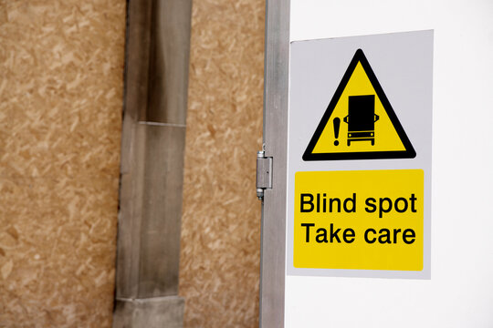 Blind spot take care sign at carpark