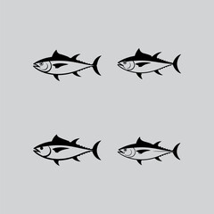 four black and white fish swimming in different directions