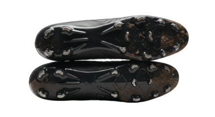 Black football cleats soles with studs, isolated on transparent background.