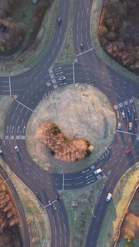 Drone View of Vehicles Moving Through Roundabout in Basingstoke, England. UK. Vertical