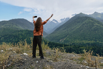 Person on mountains nature selfie hiking landscape adventure outdoors with authenticity inclusivity