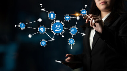 A businesswoman interacts with a digital interface showcasing legal concepts and data visualization, symbolizing innovation and technology in the modern office setting. Tessel