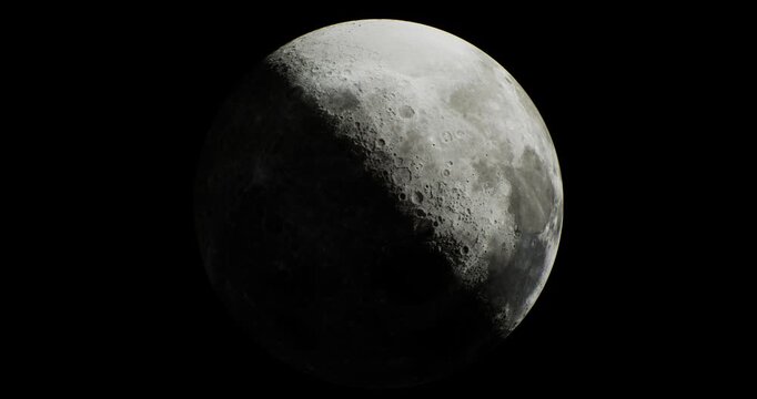 A crescent moon appears against a dark sky, highlighting its textured surface. Craters and shadows are visible, creating a captivating view during the night.