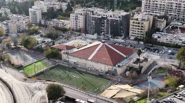 Aerial Malha Hall Hapoel Jerusalem Basketball Arena

Drone footage shows Malha Hall Hapoel Jerusalem basketball arena exterior January 1 2026 Israel

