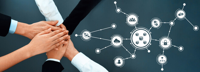 This image captures the essence of teamwork, showcasing diverse hands joining together with digital icons representing connection and collaboration in a business environment. Amity
