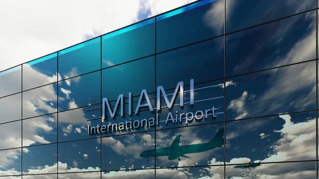 Miami international airport. Plane landing at Miami. Arrival in the city with the glass airport terminal and reflection of the jet aircraft. Travel, business, tourism and transport.