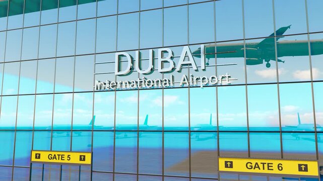 Dubai international airport. Plane landing at Dubai. Arrival in the city with the glass airport terminal and reflection of the jet aircraft. Travel, business, tourism and transport.