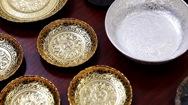 Gold and silver decorative plates with intricate patterns