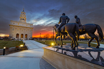 Nauvoo IL Temple at sunrise with bright red and yellow sky