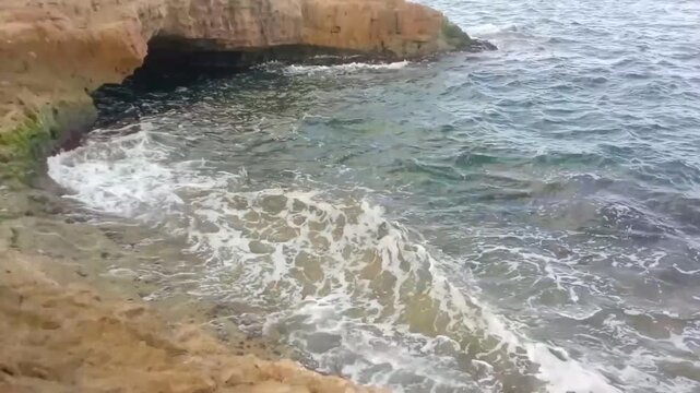 A great view of some rocks and the Mediterranean Sea is next to Masoud Well. The view is in the morning. Masoud Well is one of the tourist places in Alexandria, Egypt. It may be an ancient Greek tomb.