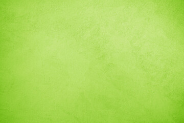 Bright light green yellow lime fresh chartreuse texture background. Painted concrete wall surface....