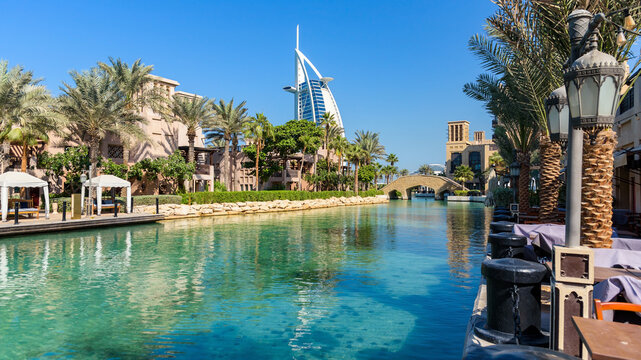 A scenic wide view of the Madinat Jumeirah resort canals and the iconic Burj Al Arab hotel in Dubai