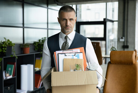 Last day at work. Upset office worker is fired. Fired and unemployment with business man. Job loss. Fired jobless employee. Unemployment crisis of man dismissed. Business man packing stuff