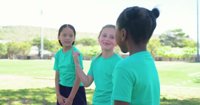 Diverse girl children with right child coming, stepping onto mats, lunging in teal tops on turf