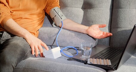 Checking Blood Pressure Comfortably At Home, Relaxed Individual Monitoring Vital Signs Using Digital Tools